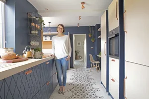 Kitchen makeover: ‘I didn’t need extension after all’ A length of hexagonal tiles creates a runway effect right through
the ground floor from the rear cloakroom to the front hall.
The design has been echoed in the diamond shapes of the drawer
fronts, which were cut to the same proportions for a matching look
