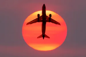 Airplane flying in front of the Sun. Credit: AscentXmedia / Getty Images Airplane flying in front of the Sun. Credit: AscentXmedia / Getty Images