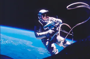 Gemini 4 Spacewalk Ed White Astronaut floats outside Gemini 4 capsule with Earth in the background