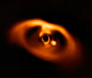 Exoplanet PDS 70b is still in the process of forming. It can be seen as a bright orange spot to the right of centre in this image captured by the SPHERE instrument on the Very Large Telescope. Credit: ESO/A. Müller et al. Exoplanet PDS 70b is still in the process of forming. It can be seen as a bright orange spot to the right of centre in this image captured by the SPHERE instrument on the Very Large Telescope. Credit: ESO/A. Müller et al.