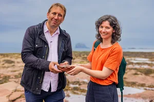 Prof Chris Lintott and Dr Claire Cousins on the beach at Milsey Bay in North Berwick looking for reduction spots in rock. Prof Chris Lintott and Dr Claire Cousins on the beach at Milsey Bay in North Berwick looking for reduction spots in rock.
