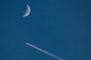 spacex rocket moon impact A SpaceX Falcon 9 rocket in the sky with a crescent Moon, 10 July 2024. Credit: George Rose/Getty Images
