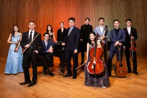 YCA for BBC Native 1_cr Chris Lee Photo Eleven young musicians posed on a stage with a selection of classical instruments