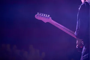 man playing electric guitar man playing electric guitar