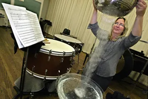 Tan Dun Water Concerto Los Angeles Master Chorale member Theresa Dimond of Los Angeles, uses a sieve to drip water to produce waterfall sounds, while rehearsing composer Tan Dun's "Water Passion After Saint Matthew. It features unusual percussion instruments used with real water: sieves, salad bowls, tubes, bubbles, etc