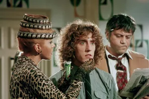 The Who Tommy Ann-Margret offers Roger Daltrey a sweet as Oliver Reed reads a newspaper in a still from the film 'Tommy' directed by Ken Russell. Ann Margret and Reed play Daltrey's on-screen parents