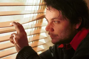 Jeff-Tweedy-2002 Close up of Jeff Tweedy, peering through blinds, circa 2002