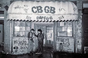 CBGB-1983 Two unidentified young men in leather jackets stand outside CBGB on February 14, 1983