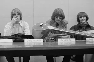 The Byrds 1967 American rock band the Byrds at a press conference with a sitar, circa 1965. From left to right, drummer Michael Clarke, bass player Chris Hillman, frontman Jim McGuinn (later Roger McGuinn) and guitarist Dave Crosby