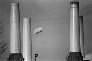 Pink Floyd Inflatable Pig Pink Floyd's inflatable flying pig glides past Battersea Power Station, London, during the filming of a promo video for the Animals album, December 1976