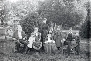 Family Posing on Lawn (Original Caption) Prosperous Victorian Family - three generations united in garden setting.