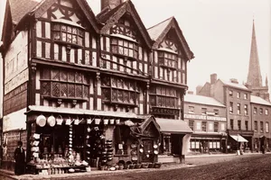 Hereford, Old House in High Town, c 1880. ENGLAND - SEPTEMBER 03: A photographic view of the Old House in High Town, Hereford, published by Francis Bedford & Co. In 1862, all the buildings surrounding this house were demolished to allow traffic to pass more easily. This building was left standing as a fine example of seventeenth century architecture. The shop displays buckets, watering cans, tin baths and earthenware bottles. Bedford (1816-1894) was a prolific and well-respected photographer, best known for his numerous topographic and architectural views of Britain. During the 1860s and 1870s Bedford travelled extensively throughout Britain, taking hundreds of views of British scenery. He was assisted by his son, William (1846-1893) whose work is almost indistinguishable from that of his father. (Photo by SSPL/Getty Images)