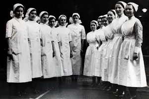 Goodbye To Victorian Waists For Nurses Nurses modelling their old and new uniforms at the Sheffield Royal Hospital, England. The Victorian waistline and starched cuffs and collars of the nursing staff have gone. In place of the outfit which British nurses have worn for more than half a century the nurses are now wearing one-piece white tunics, fastened down the front, short sleeves and soft collars. Instead of the elaborate bonnet there is a simple cap of white muslin. (Photo by Fox Photos/Hulton Archive/Getty Images)