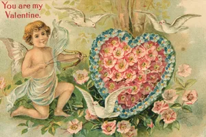 You Are My Valentine Valentine's card showing Cupid with a bow and arrow and a heart made of pink flowers with text saying 'You Are My Valentine'