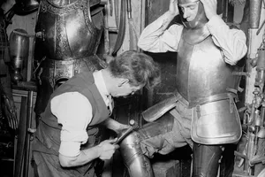 Swordmaker 20th October 1931: Armourer Sam Rex works on a suit of armour at his workshop in Little White Lion Street near Seven Dials, London. (Photo by Fox Photos/Getty Images)
