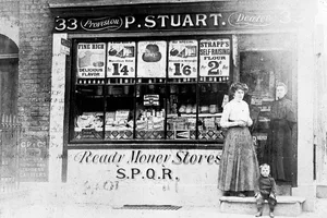 P Stuart’s Grocery Shop, King Henry Street, Islington, London. P Stuart's Grocery Shop, King Henry Street, Islington, London. The shop front, with two women and a small boy in the doorway to the shop. The shop window is full of groceries and signs. Two signs attached to the wall above the shop advertise Colman's mustard and starch. (Photo by Museum of London/Heritage Images/Getty Images)