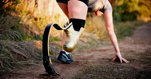 Woman, start and running with prosthetic leg in nature for sprint, race or outdoor workout on trail. Active, runner or female person with a disability getting ready to begin cardio exercise or launch Woman, start and running with prosthetic leg in nature for sprint, race or outdoor workout on trail. Active, runner or female person with a disability getting ready to begin cardio exercise or launch