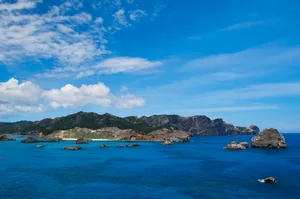 Boulders and blue water. Chichi-Jima Island, Ogasawara Island Group, Japan.