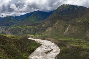 Panorama view of Yarlung Tsangpo (Yarlung Zangbo) Grand Canyon , Brahmaputra Canyon or Tsangpo Gorge and Yarlung Tsangpo River in summer wit blue sky cloud, Tibet, China VogelSP/ Getty Images