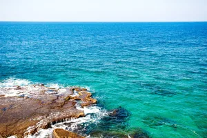 Ocean or sea view with turquoise water and stones Ocean or sea view with turquoise water and stones at the foreground