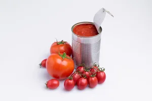 in of chopped canned tomatoes with whole fresh tomatoes, isolated on white background, soft light in of chopped canned tomatoes with whole fresh tomatoes, isolated on white background, soft light