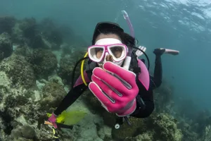 Suchana “Apple” Chavanich holds a piece of coral collected as sample in a reef near Samae San Island, Chonburi, Thailand Suchana "Apple" Chavanich holds a piece of coral collected as sample in a reef near Samae San Island, Chonburi, Thailand
