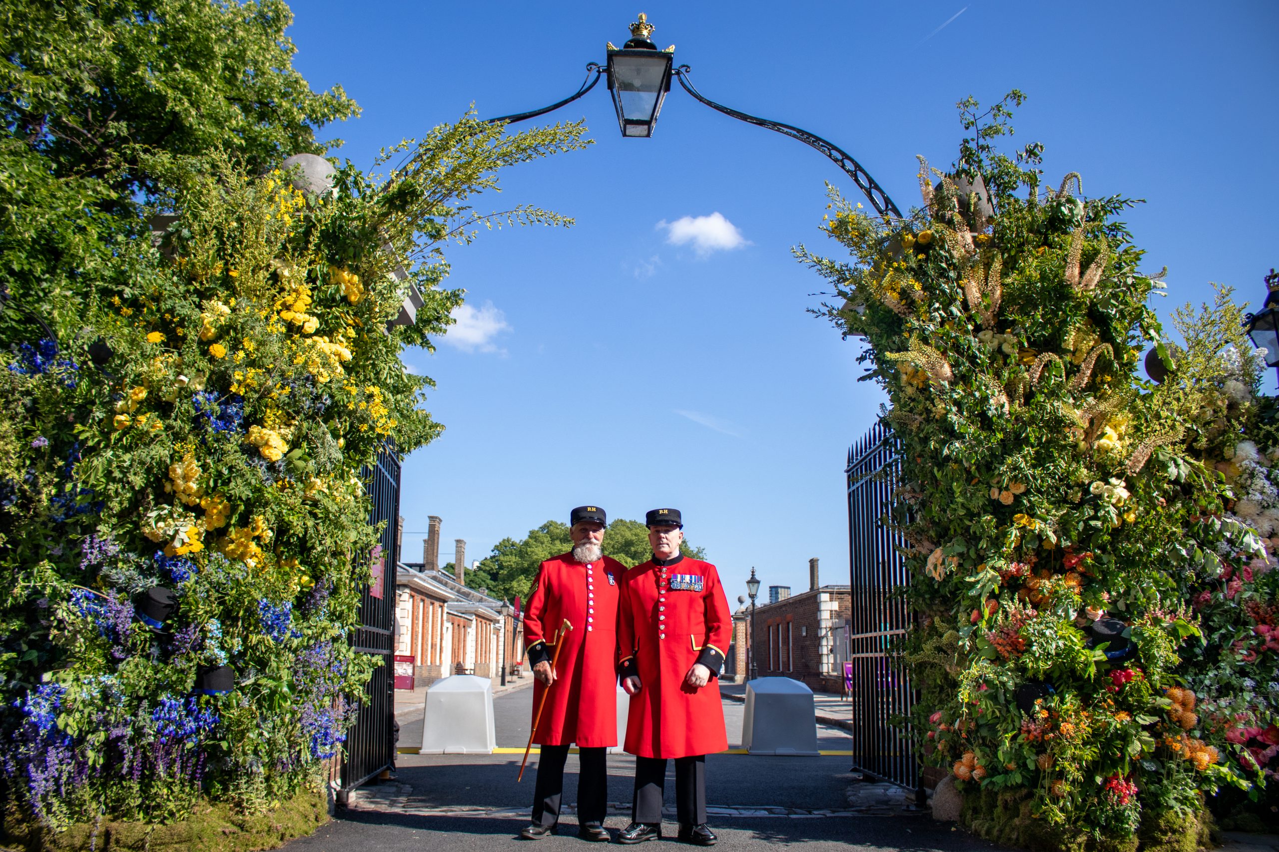 The entry gates to RHS Chelsea Flower Show 2025 with floral design created by Lavender Green