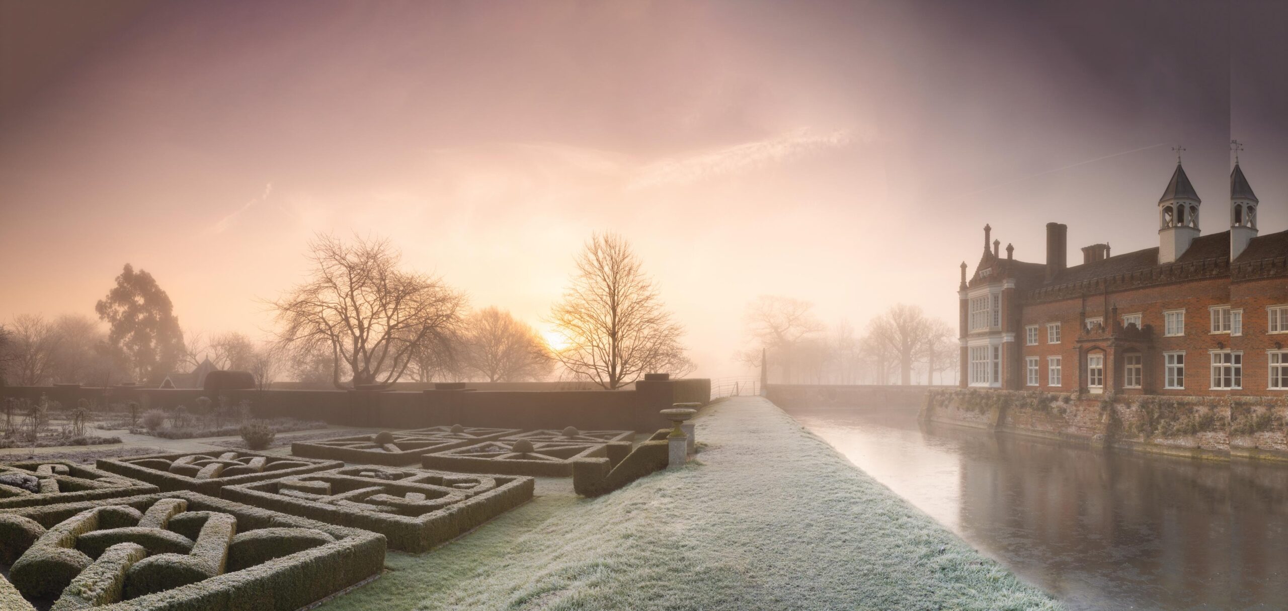 Stately home garden and house at sunrise