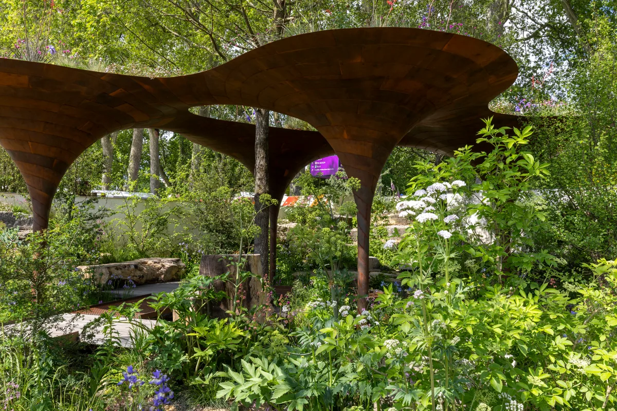 The WaterAid Garden. Designed by Tom Massey and Je Ahn at RHS Chelsea Flower Show 2024. Sponsored by Project Giving Back. In support of WaterAid. Show Garden