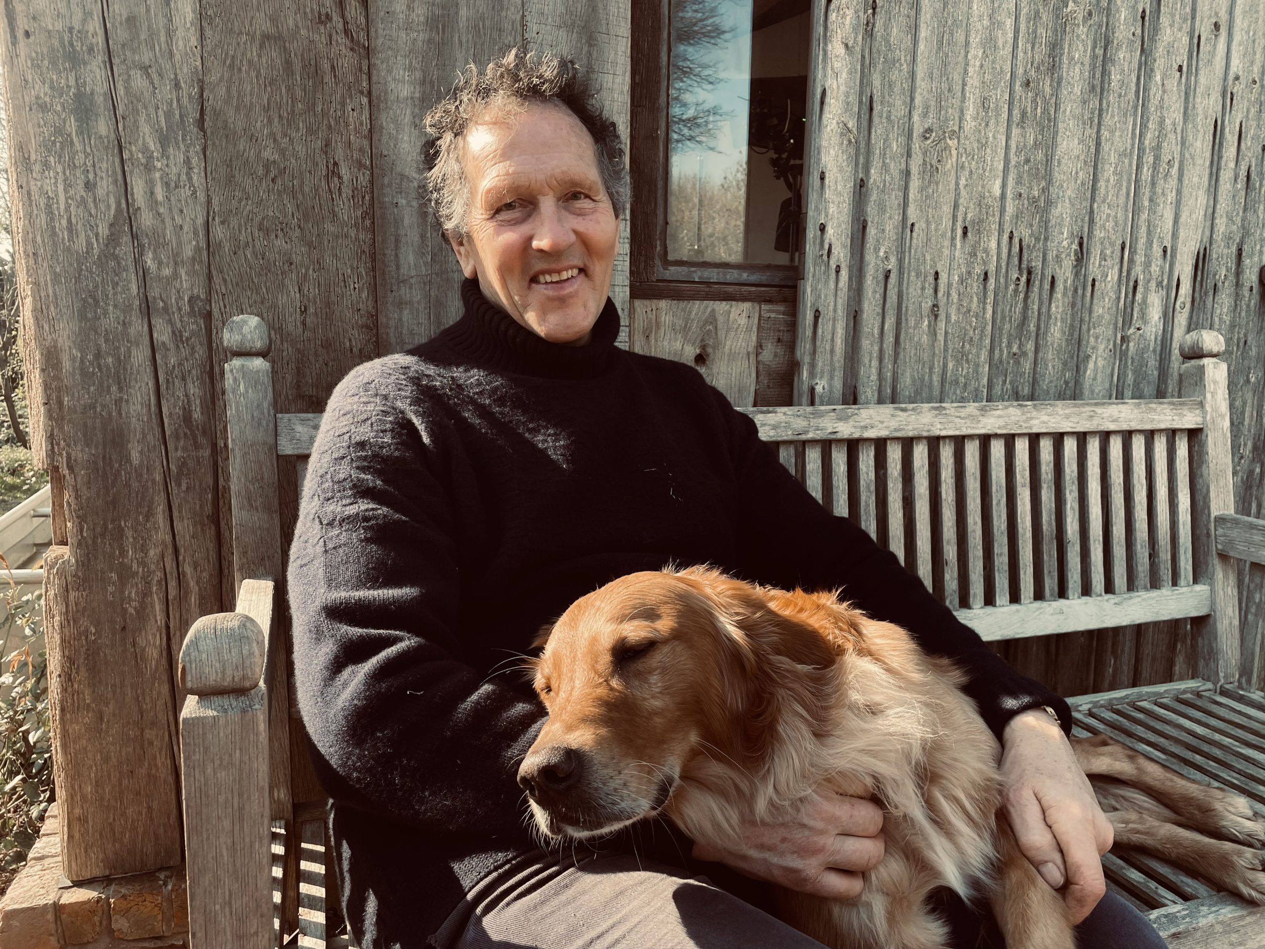 Monty Don and his dog Ned in the garden at Longmeadow