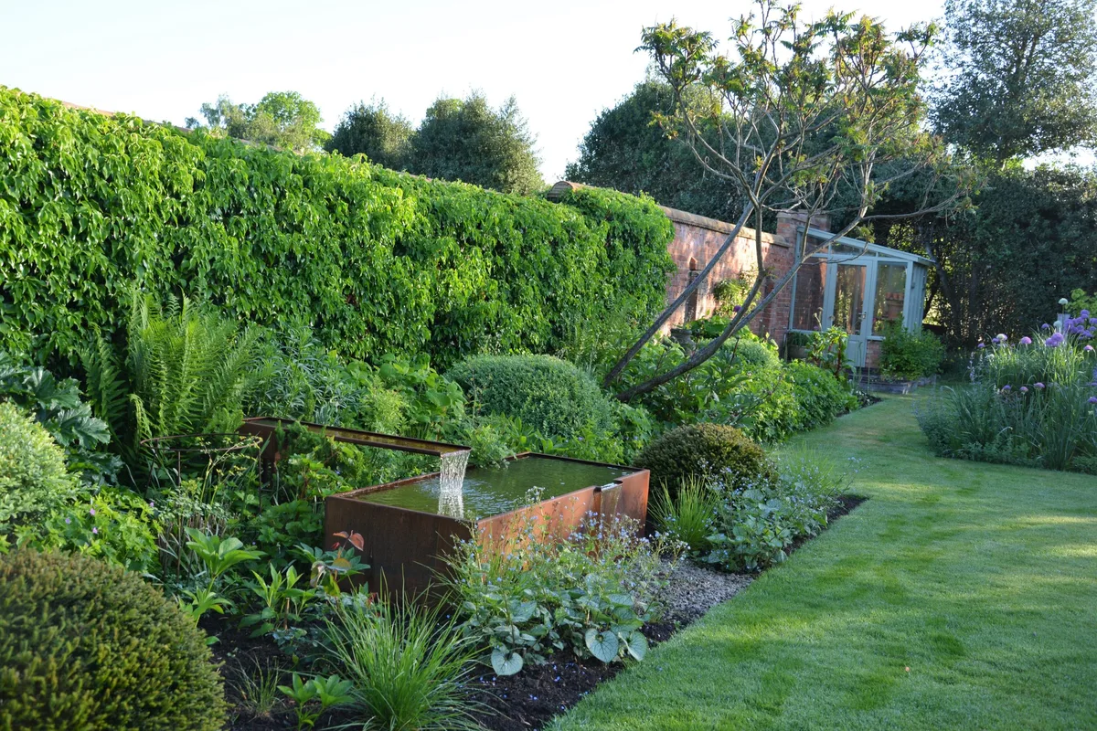 Hard landscaping elements are softened with planting.