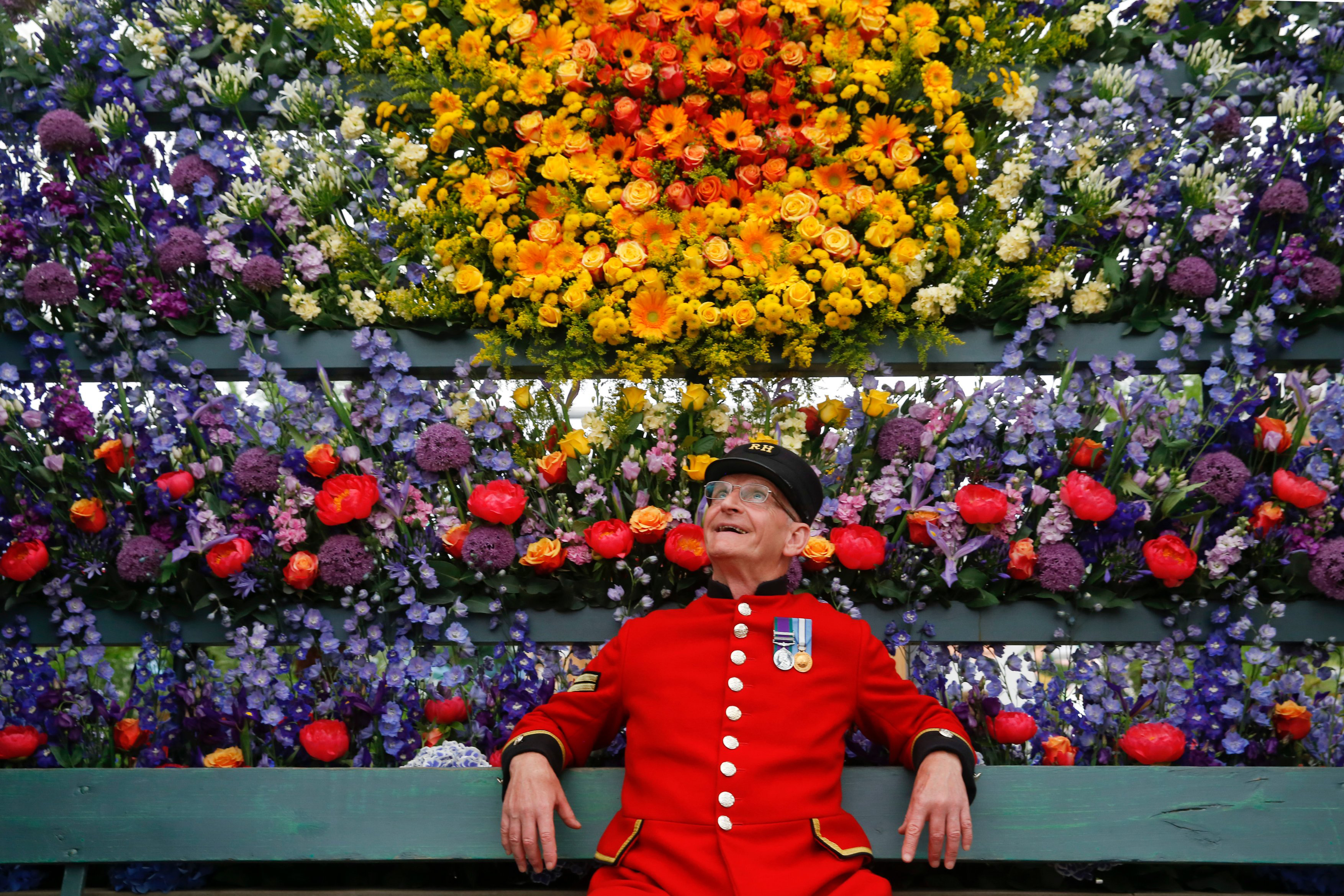 Chelsea Pensioner Paul Whittick enjoys the display on the Marks and Spencer Floral Market exhibition  during press day at the RHS Chelsea Flower Show 2018. RHS / Luke MacGregor