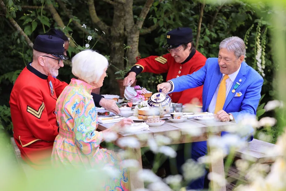 The National Garden Scheme Garden from RHS Chelsea Flower Show 2024. President of the National Garden Scheme, Dame Mary Berry is joined for tea by Alan Titchmarsh, two Chelsea Pensioners