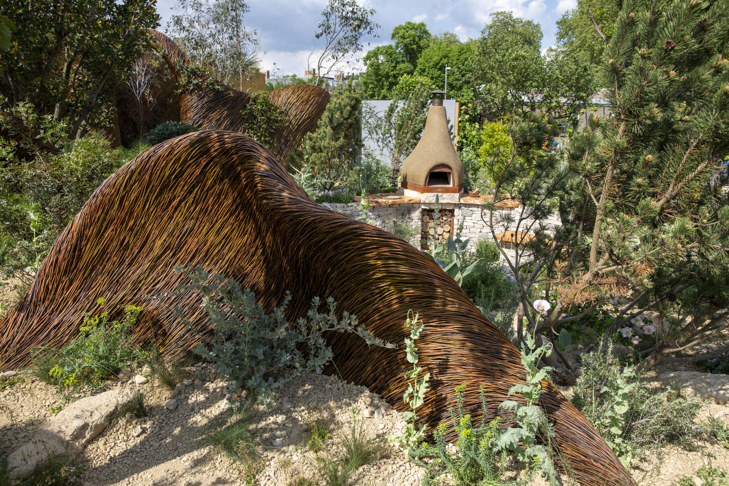 The Freedom from Torture Garden: A Sanctuary for Survivors at RHS Chelsea Flower Show 2024. Designed by John Warland and Emma O’Connell. Sponsored by Project Giving Back.