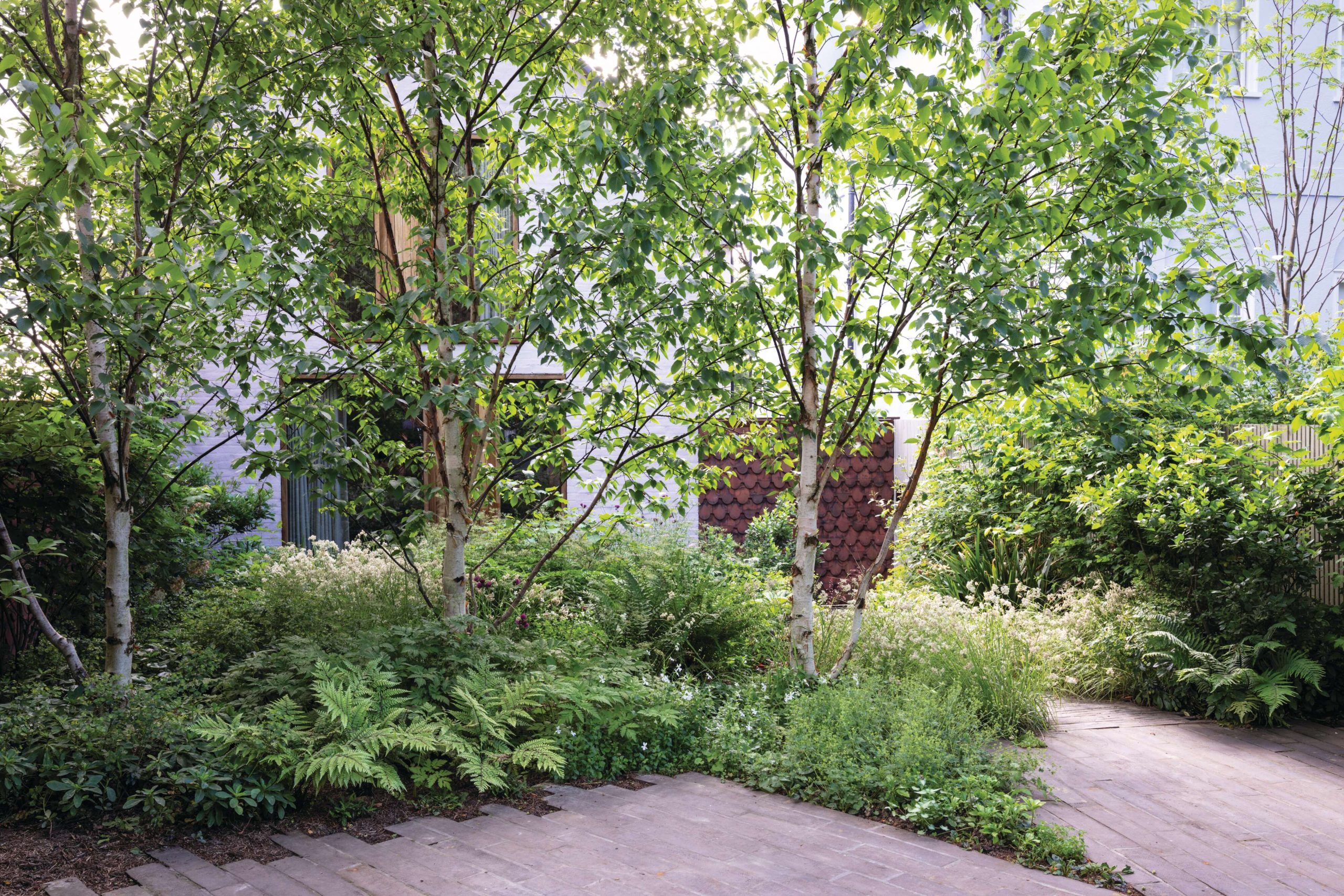A parking space within a front garden designed by Jane Brockbank